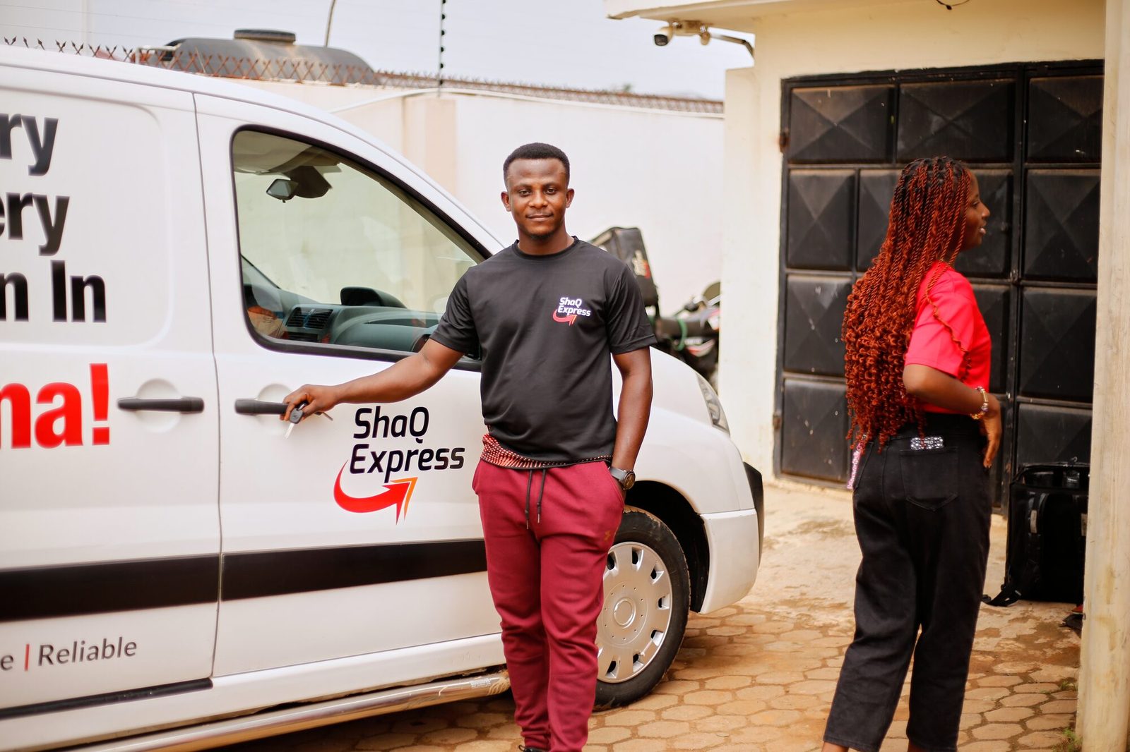 A ShaQ Express driver with the keys to a branded delivery van
